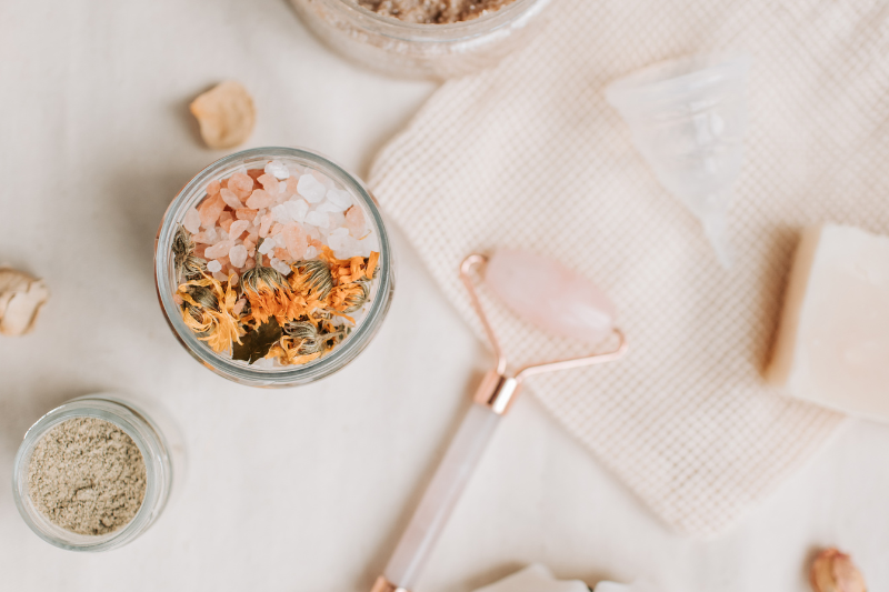starting a spiritual journey with a self care ritual (multiple self care products in a pink hue
